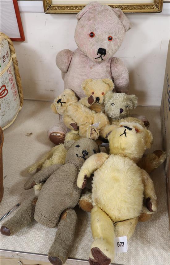 Seven plush teddy bears and another